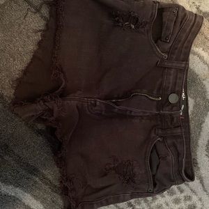 black ripped shorts